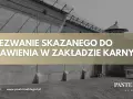 Wezwanie skazanego do stawienia w zakładzie karnym, zgodnie z art. 79 kkw. Widok murów więziennych i wieżyczki strażniczej.