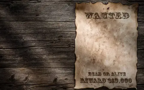 Stary, zniszczony list gończy wzór na drewnianej ścianie. "WANTED DEAD OR ALIVE REWARD $10,000".
