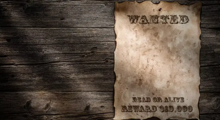 Stary, zniszczony list gończy wzór na drewnianej ścianie. "WANTED DEAD OR ALIVE REWARD $10,000".