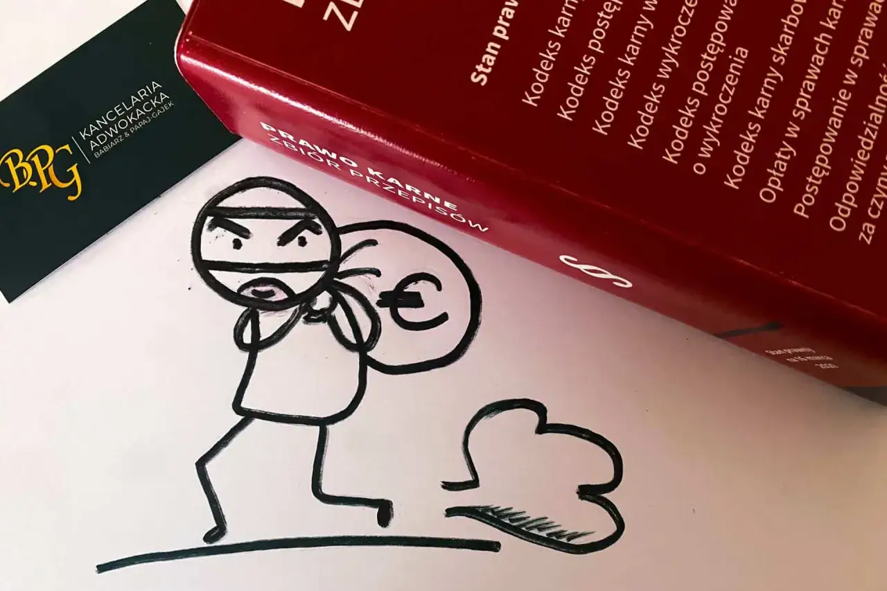 Rysunek złodziejaszka z workiem euro obok Kodeksu karnego, nawiązujący do art. 278a par. 1 kk.